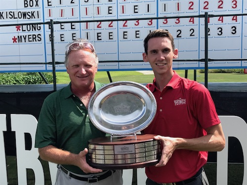 2017 World Am winner Curtis Henley of Poquoson, Va. (left) accepts the championship trophy from World Am Tournament Director Scott Tomasello.